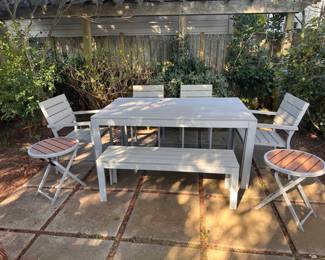 $200. Outdoor table with 2 side chairs, 2 arm chairs and a bench. Small round tables sold separately in person. Table is 63"w x 39"d x 29"h.