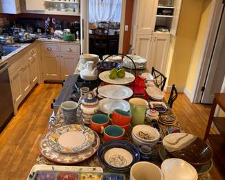 Pottery and other kitchen items for sale in person.