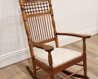 Antique Oak Stick and Ball Spindle Rocking Chair with Carved Panel