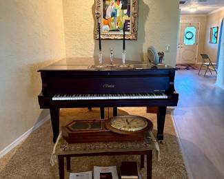 Baby grand piano, clock, modern art