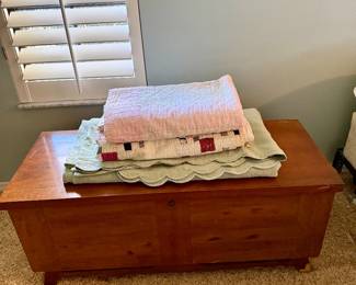 Lane chest, quilts