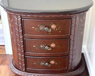 Three drawer chest with floral designs and a faux marble top