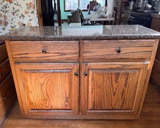 Oak kitchen island on wheels with granite top