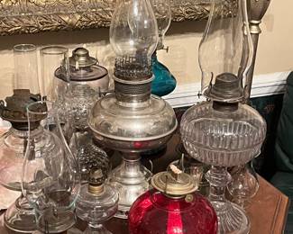 Assorted oil lamps in different sizes and colors