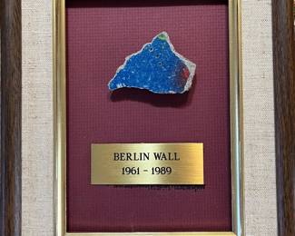 Framed piece of Berlin Wall with certificate and picture 