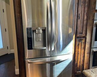 LG - side by side with bottom freezer. Includes an additional water filter.