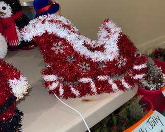 Vintage Santa, sleigh and other pieces. Totes on the floor are loaded with holiday decor - update or redo your trees. Sold by the tote only!