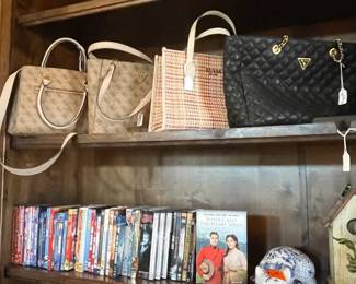 Guess purses and family movies. Happiness on a shelf!
