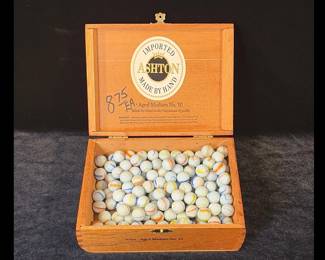 Vintage marbles and wooden cigar box