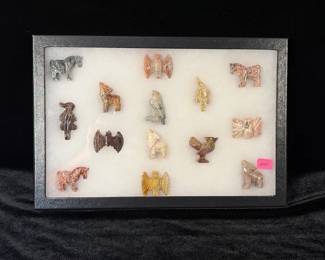 Display case with hand carved stone animals