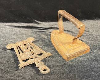 Antique iron with ornate castiron trivet