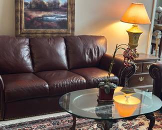 Leather couch and loveseat, glass top coffee table 