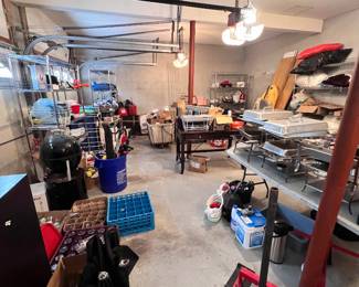 Packed garage from furniture to beer glasses