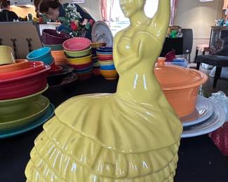Yellow Ceramic Figurine of a Woman in a Hat and Ruffled Dress  Shawnee USA