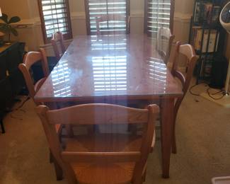 Lot 114:Dining room table with custom glass top .. cane bottom chairs with two Captain's chairs and four regular chairs. 72X36