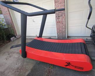 Lot 38:True form trainer manual treadmill with Pace speed. Distance time display. Very expensive and this one is like brand new. We moved it outside because there was no more room in the garage to photograph. Very heavy! Has front casters for moving?