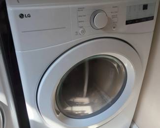 Lot 22:Lg electric dryer, stackable. Model number dle3400w. We dried a load of clothes and it works fine. Electric dryer