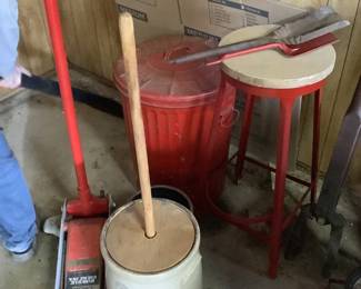 Bitter churn, car jack lift, metal stool, red trash can