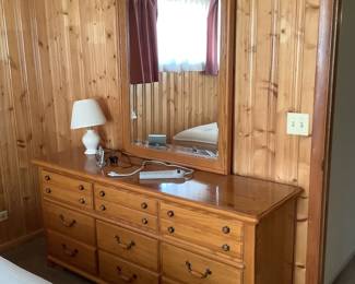 Triple dresser with mirror. Presale $250.  Measures68” w x 20” d x 32” h.  Mirror measures 34” w x 2” d x 46” h.