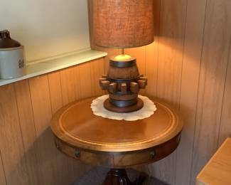 Beautiful antique round table with barrel/peg lamp