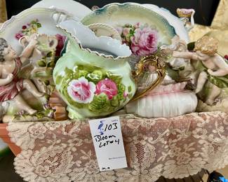 Basket of vintage porcelain, decorative plates, and more