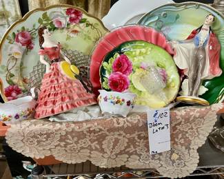 Basket of vintage decorative, porcelain plates, figurines, and more