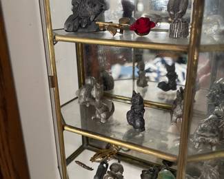 tiny glass & brass cabinet filled with pewter figurines (mostly animals)