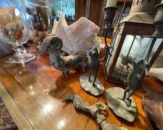 so many cool things -- ranging from beautiful shells to old lantern, dancing frog candle holders and beautiful facuet
