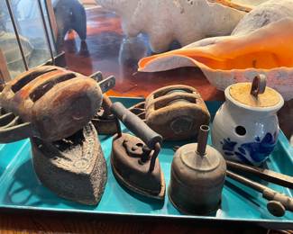 old pulleys, sextant, iron door stops