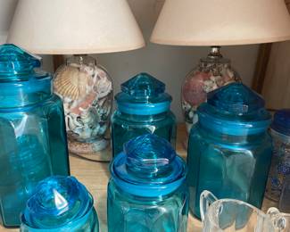blue glass canisters, shell-filled lamps