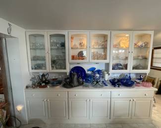 lots of pretty things for the table -- also the cabinets below are stacked with christmas dinnerware and platters