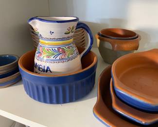 blue ceramic, with terracota interior, plates and serving pieces