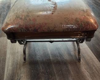 Antique footstool with metal base