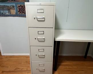D28 - $25. Hon 4 Drawer Metal Filing Cabinet. Measures 15" wide x 25" deep x 48.75" tall. 