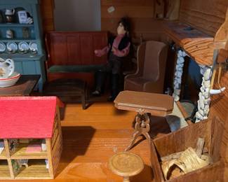 D60 - $50. Wooden Dollhouse. Measures 26" wide x 14.5" deep x 19.25" tall. 