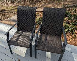 D133 - $30. Pair of woven plastic chairs. 