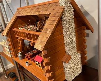 D60 - $50. Wooden Dollhouse. Measures 26" wide x 14.5" deep x 19.25" tall. 