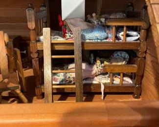 D60 - $50. Wooden Dollhouse. Measures 26" wide x 14.5" deep x 19.25" tall. 