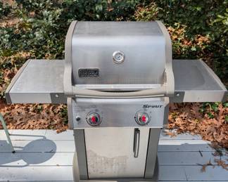 D128 - $100. Weber Spirit S210 Grill with cover and propane tank. 