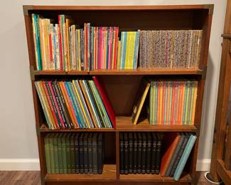 D79 - $60. Solid Wood Bookcase with Decorative Brass Braces at each Joint. Measures 36" wide x 9.25" deep x 42.5" tall. 