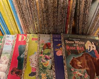 D84 - $50. Set of 57 Golden Books from 1950s. Fair condition. Some writing & cutting in paper doll editions. 