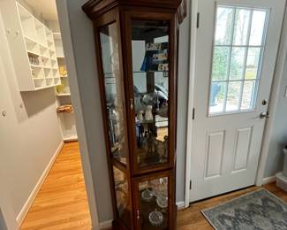 D31 - $85. Lighted Curio Cabinet with adjustable glass shelves. Measures 29" wide x 14" deep x 71" tall. Moves in 1 piece. 