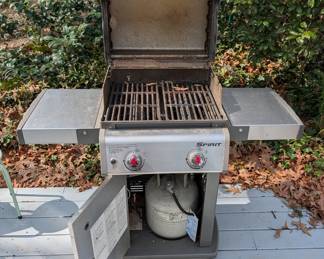 D128 - $100. Weber Spirit S210 Grill with cover and propane tank. 
