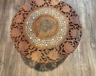 D63 - $40. Carved Wooden Table / Plant Stand with removable base. Inlay design on the top. Measures 15" across x 15.5" tall. 