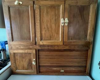 D180 - $275. Antique Hoosier Cabinet. Very good condition overall. Some pieces have been replaced but lots of original character! Measures 40" wide x 25" deep x 71" tall assembled. (Base is 33" Top is 38")
