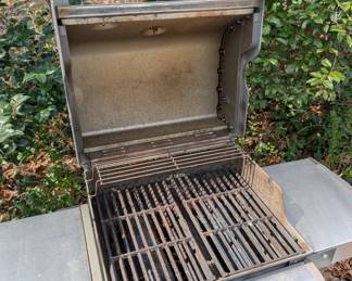 D128 - $100. Weber Spirit S210 Grill with cover and propane tank. 