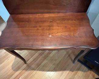 D44 - $60. Flip Top Game Table. Measures 41" x 21" deep x 30.5" tall. Has some veneer chipping. 