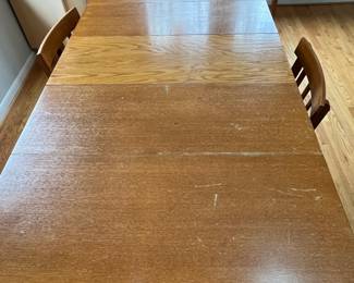 D33 - $175. Drop Leaf Dining Table with 5 Chairs. Measures 38" x 59.25" with drop leaves out x 30.5" tall. Each Drop Leaf is 16". Removable leaf is 14". All pieces are wooden - Chairs could use tightening up. Table top shows some wear. But a solid Vintage Set!