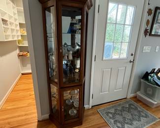 D31 - $85. Lighted Curio Cabinet with adjustable glass shelves. Measures 29" wide x 14" deep x 71" tall. Moves in 1 piece. 