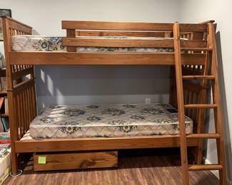 D76 - $150. Wooden Bunk Bed with Ladder & Drawer. Includes 2 regular twin mattresses but it is long enough to fit twin XL. Can be used as individual beds as well if you don't want them stacked. Measures 83" x 43" x 65" tall.  Located in a walk out basement but you will need 2 people to disassemble and move out!